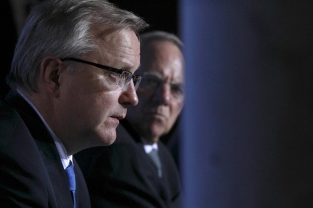 EU-Vize-Präsident Olli Rehn (links) mahnt Steuerreduzierungen in Deutschland an. Foto: Reuters